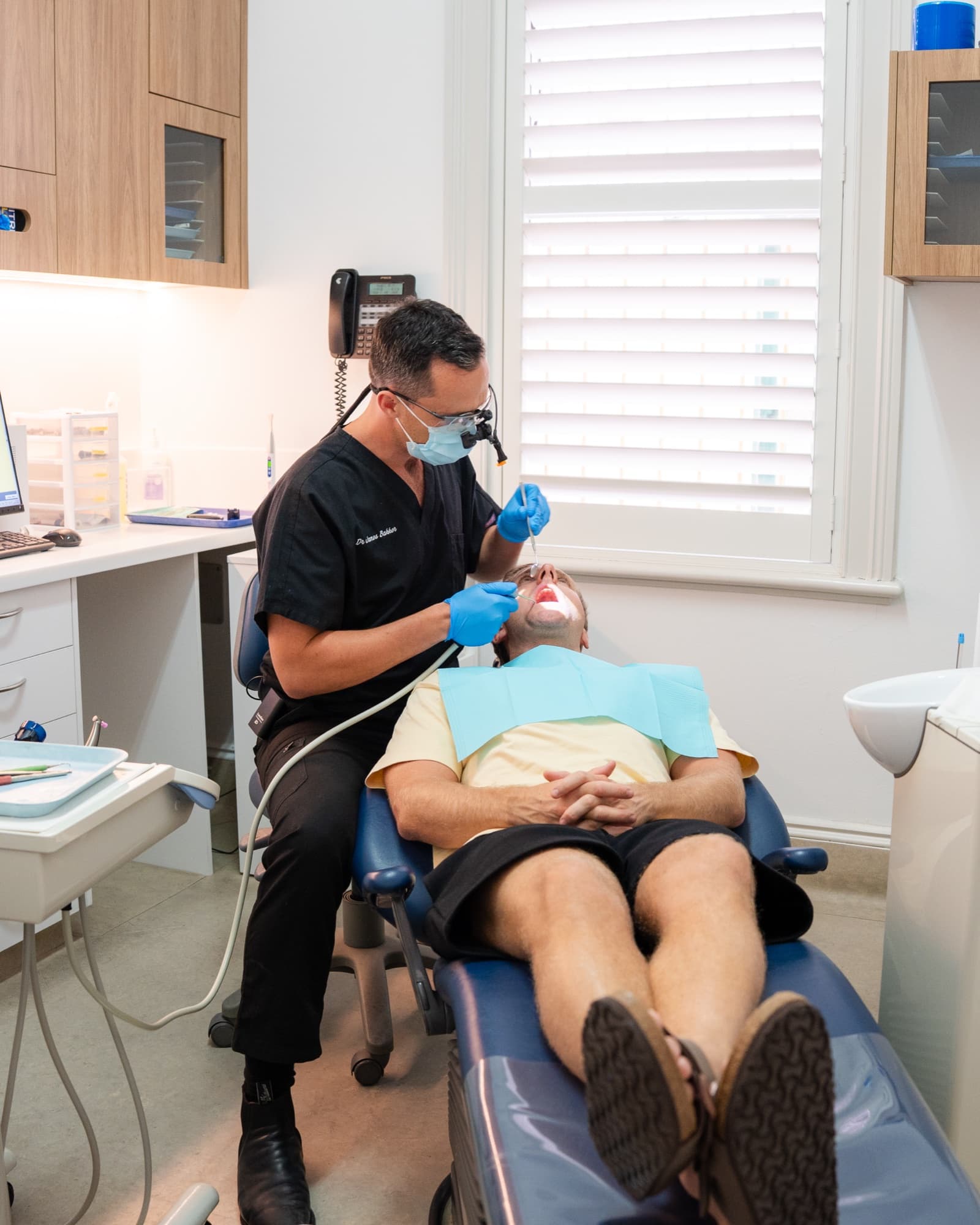 Dr James Bakker placing a tooth-coloured filling